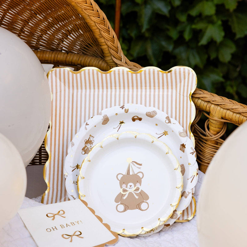 Teddy bear baby plates styled with striped napkins and baby decor