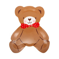 Close-up of teddy bear plate with red polka-dot bow
