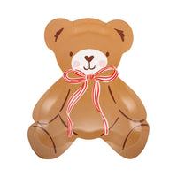 Close-up of teddy bear plate with striped ribbon bow