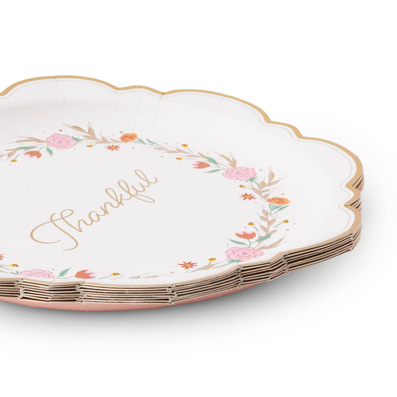 Angled stack of Thankful fall floral paper dinner plates showing the gold scalloped edge