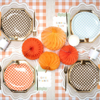 thanksgiving table setting with beige wavy scallop paper placemats
