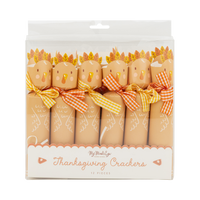 Clear packaging of a thanksgiving turkey crackers with decorative bows on a white background.