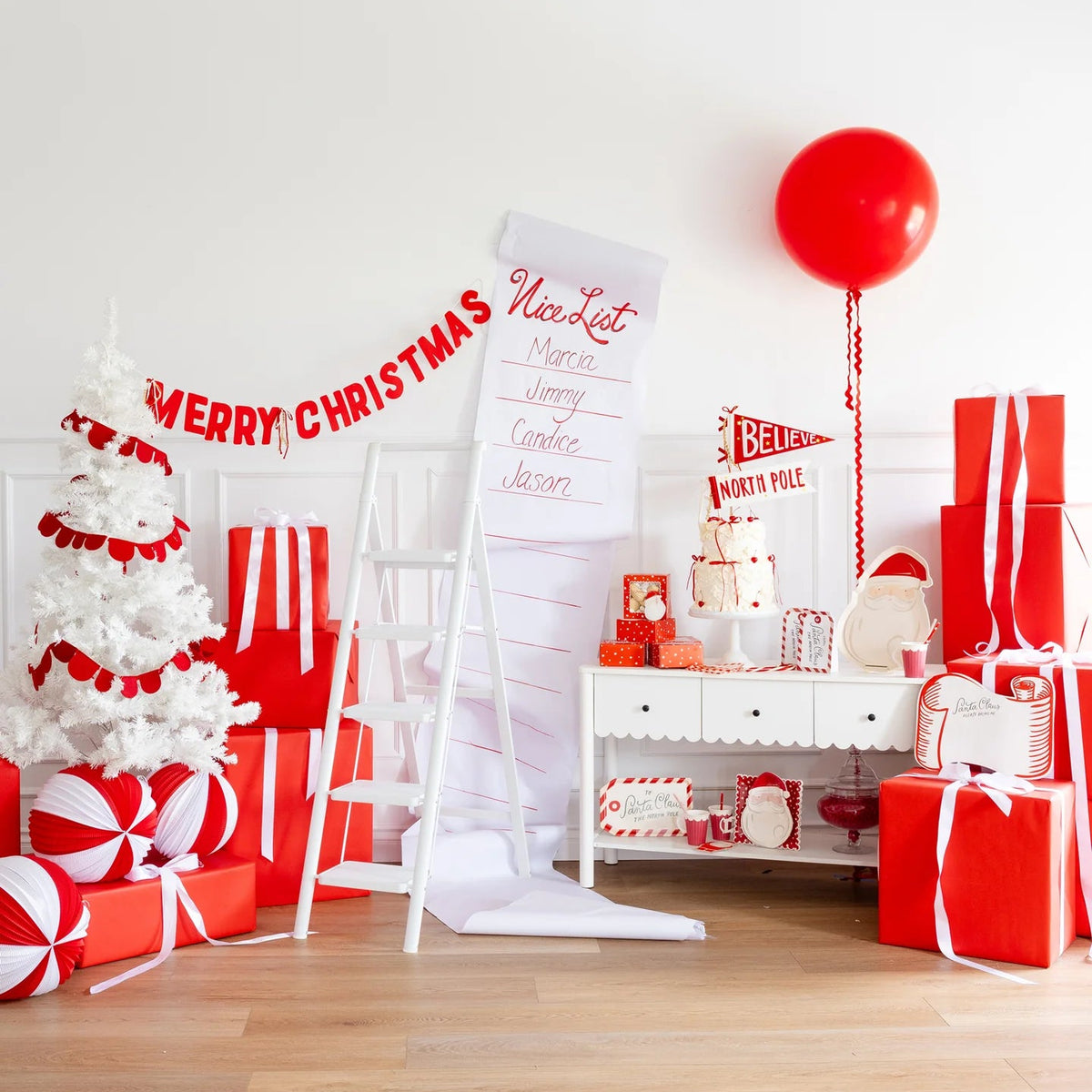 Vertical lifestyle shot with oversized Nice List and felt Merry Christmas banner above holiday vignette.