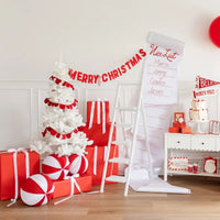Styled room scene featuring white tree and the felt Merry Christmas banner as Christmas mantel decor.