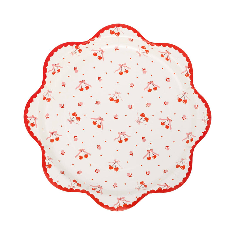 scalloped plate with tossed cherry pattern and red scalloped border
