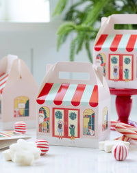 Toy Store treat boxes styled on a party table with candy and holiday décor
