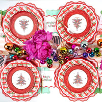 Overhead of four tree plates on red scalloped plates around pink peonies and a "Merry Christmas" napkin.