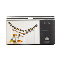 Back of retail packaging for the Trick or Treat felt banner. Black box with white brushstroke stripe detail at top. Left side shows a styled photo of the banner hung above a Halloween dessert table. Right side shows "My Mind's Eye Paper Goods" logo, "TRICK OR TREAT Felt Banner · 6 ft," SKU SPS1302, barcode, and "Designed in USA · Made in China · ©2026 My Mind's Eye."