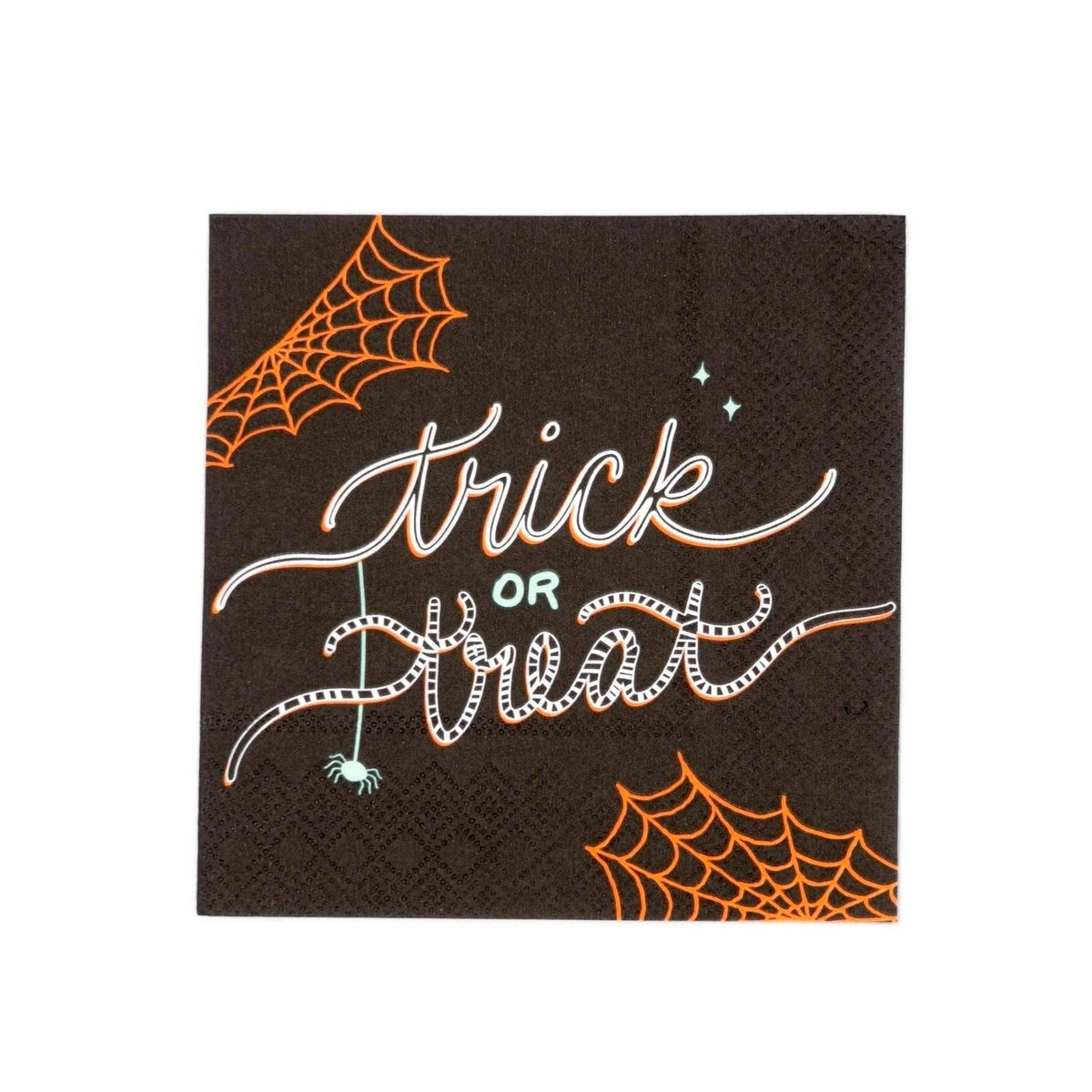 Black "trick or treat" Halloween cocktail napkin with whimsical white script lettering, orange spiderweb corners, and a small spider, flat view on white background.