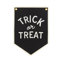 Trick or Treat Halloween felt banner in black with cream felt lettering, cream canvas border and brass grommets