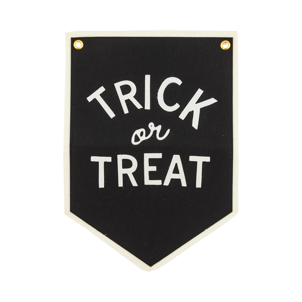 Trick or Treat Halloween felt banner in black with cream felt lettering, cream canvas border and brass grommets