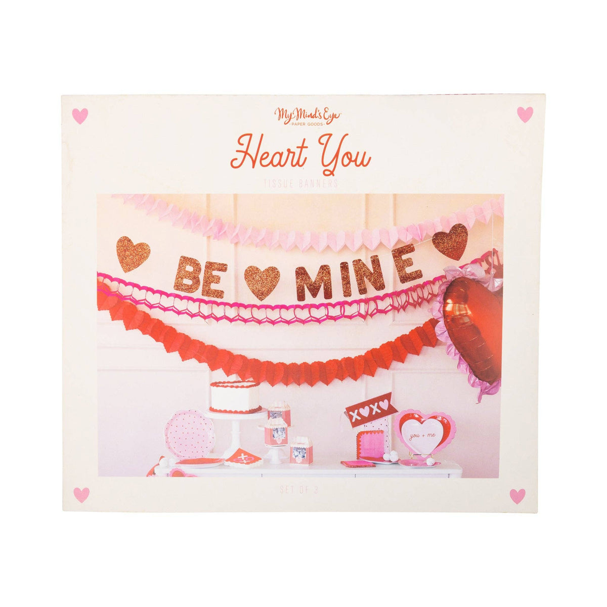 Triple heart tissue garlands hanging on Valentine party backdrop