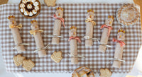 Decorative items for autumn highlighting the turkey party crackers on a checkered tablecloth.