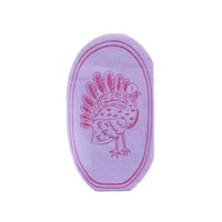 Die-cut turkey shaped napkin in a purple and lilac turkey silhouette on an oval shape, front view on white background.
