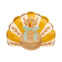 Die-cut turkey-shaped paper plate with a bow, front view on a white background.