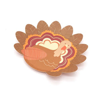 Smaller-scale turkey shaped plate shown at an angle, highlighting the full turkey shape and gold foil accents.