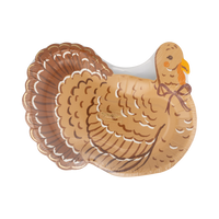 Angled view of the turkey shaped plate showing the full-body illustrated turkey, warm brown tones, and gold foil feather detail.