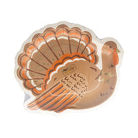 Close-up of gold-foil detailing on the turkey plate’s feathers.