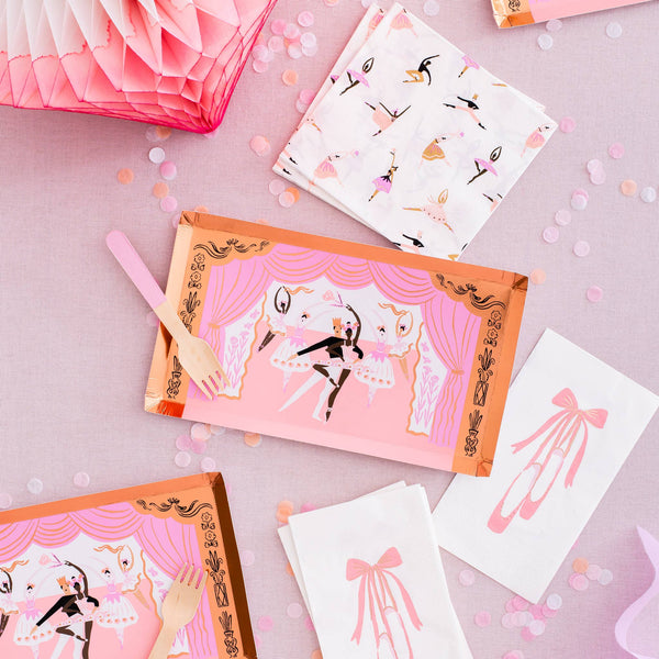 Video display showing tutu-shaped paper plates, striped gold cups, and ballerina guest napkins for a "Tutu Cute" party.