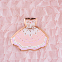 A single pink tutu-shaped paper plate with rose gold foil trim centered on a ruffled pink tulle background.