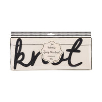 Black glitter “Tying the Knot” banner packaged in clear sleeve with striped header