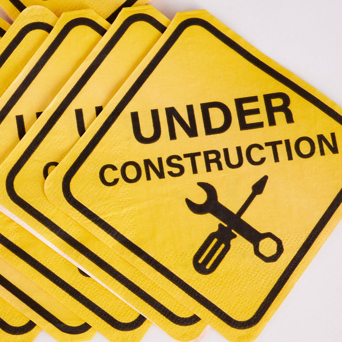 stack of construction sign shaped napkins