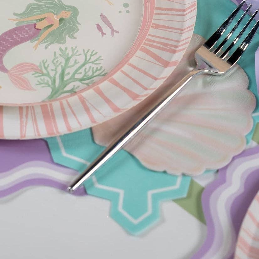 under the sea napkins with shell shape and pastel table setting.