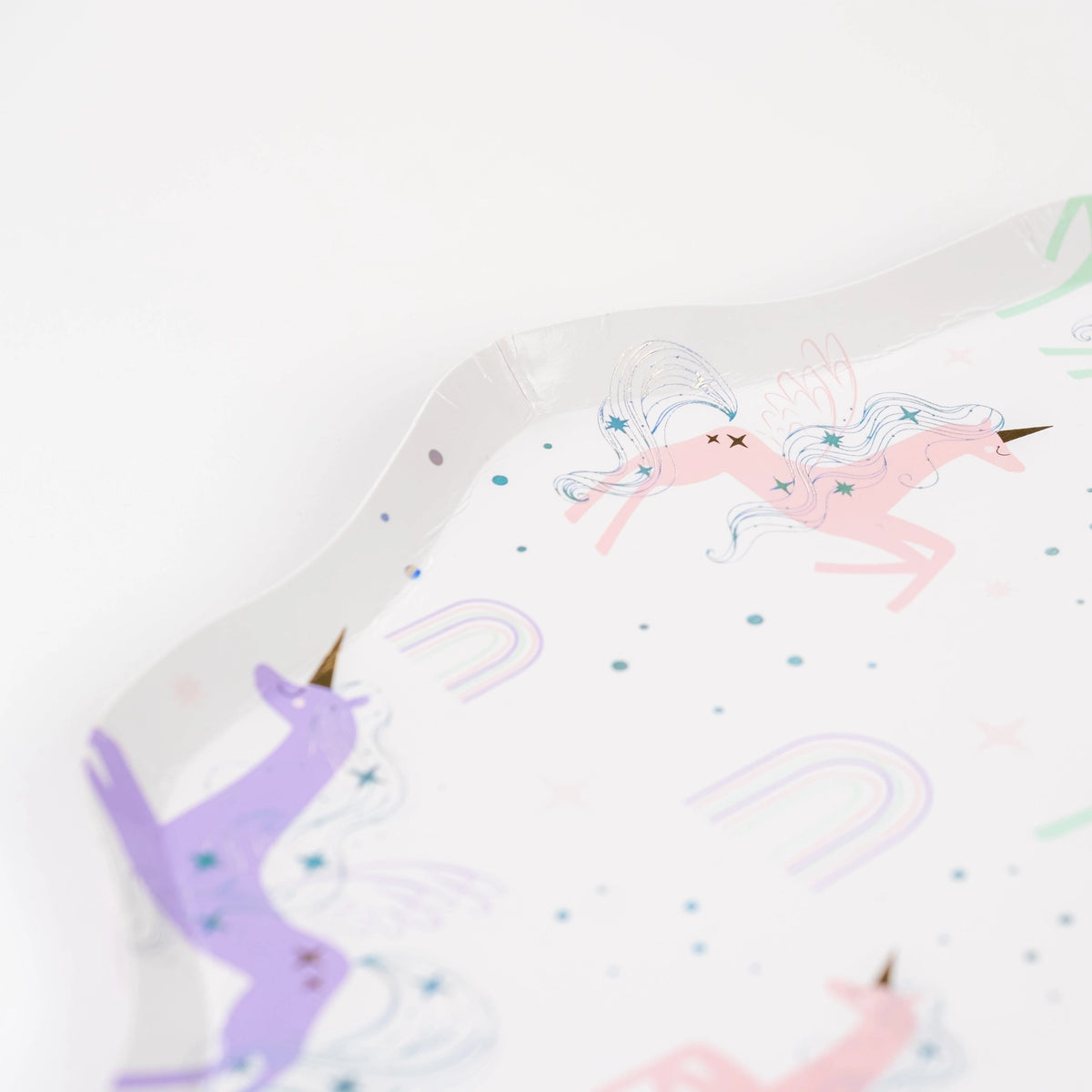 Close detail of holographic mane on pastel unicorn with mini rainbows.