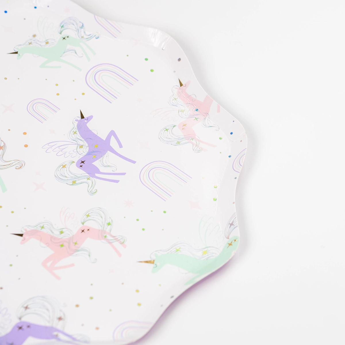 Corner view showing scalloped edge and mint, pink, and lavender unicorns.