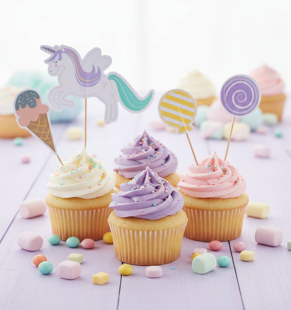 Cupcakes with pastel frosting and unicorn balloon and ice cream toppers