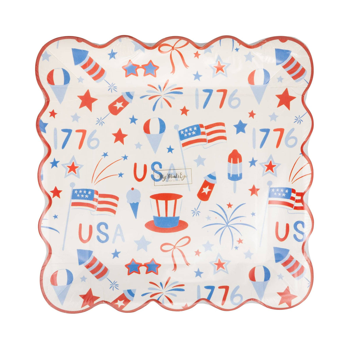 Front view of USA icons scalloped paper plate in packaging showing all-over red white and blue print with flags fireworks stars and 1776