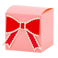 Pink bow treat box with red scalloped bow accent for Valentine’s Day treats