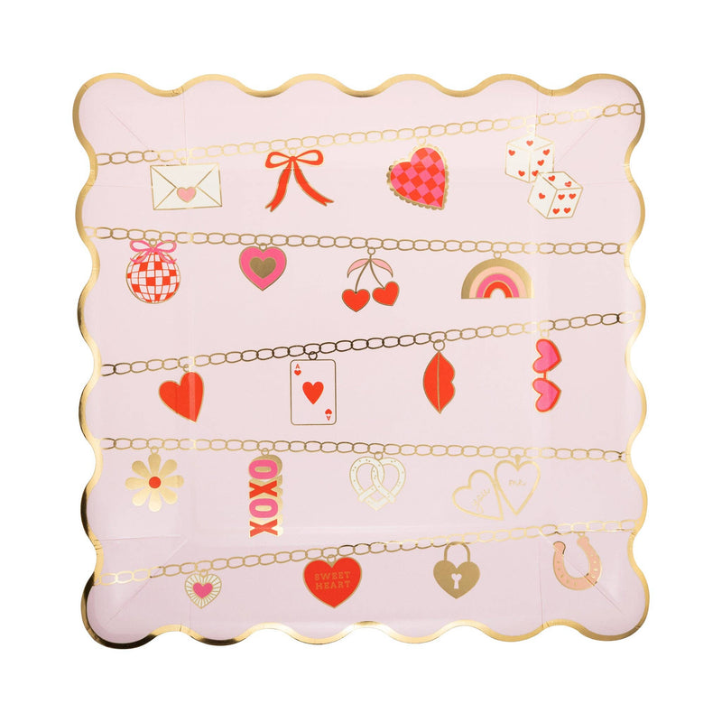 Pink scalloped square Valentine plate with gold foil edges and charm bracelet icons including hearts, cherries, dice, and bows.