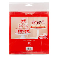 Back packaging showing pink and red bow treat boxes styled on dessert stands