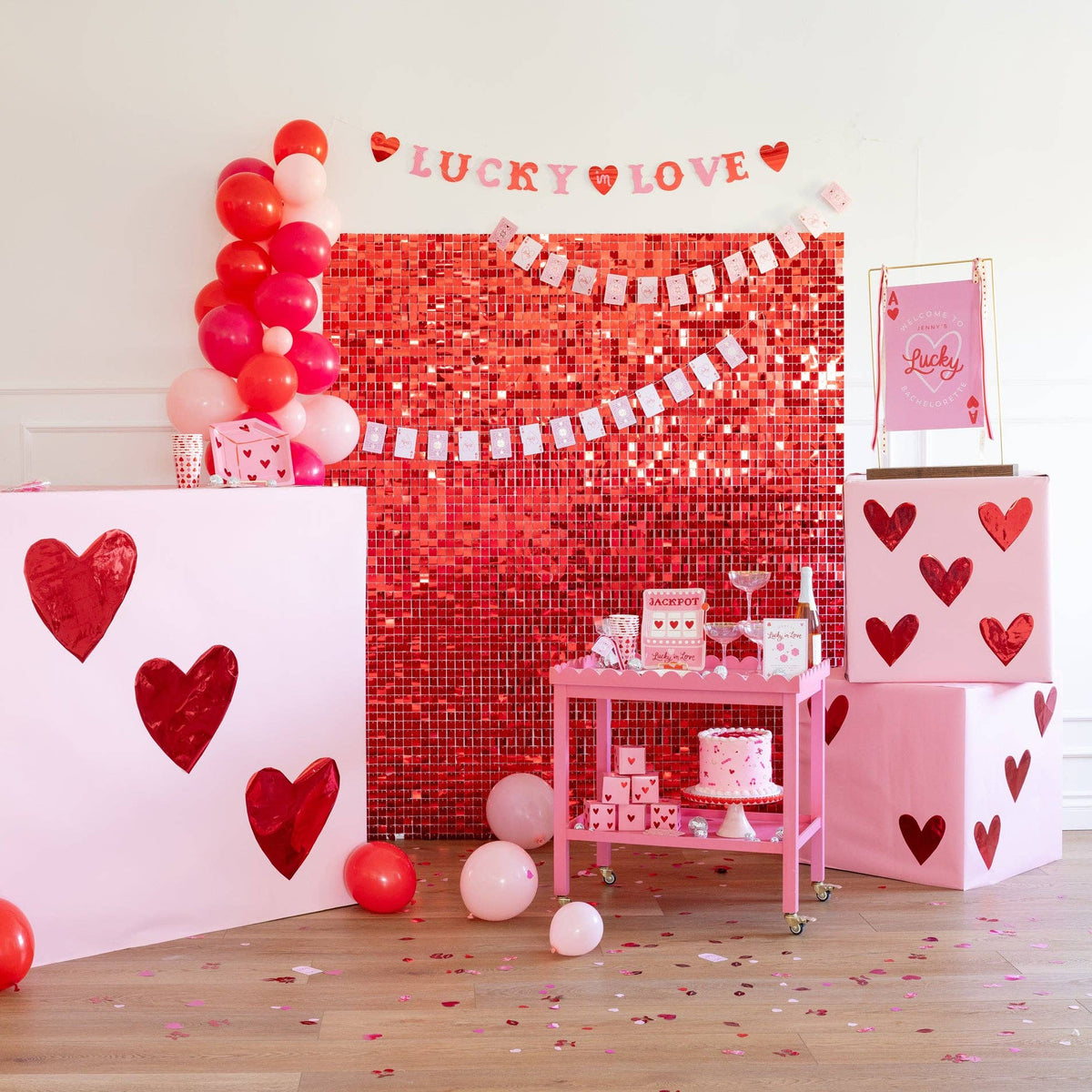 Playing card paper banner styled for a Valentine’s Day party backdrop