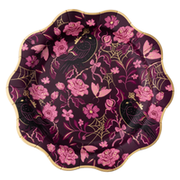 Plum gothic floral paper dinner plate with pink roses, black ravens, gold foil spiderwebs, and skeleton keys, with a scalloped gold foil rim, on a white background.