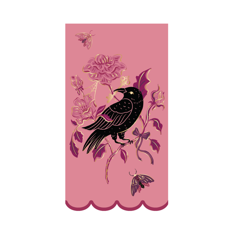 Pink gothic paper guest towel with a black raven, magenta roses, gold-foil moths, and a scalloped edge, on a white background.