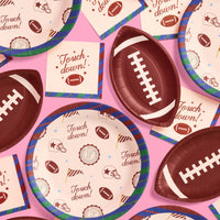 Varsity football party plates flat lay showing round and football-shaped designs