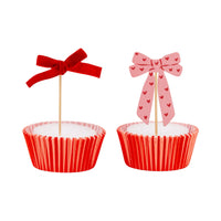 Red velvet ribbon bow cupcake topper on cupcake