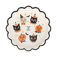 Cream scalloped paper plate with vintage trick-or-treat character icons, front view.