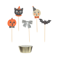 Halloween-themed cupcake toppers with a black and gold cupcake liner.
