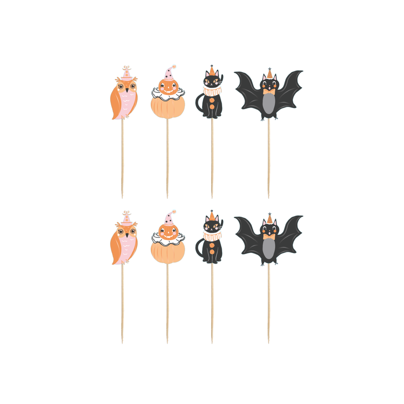 Set of vintage Halloween cupcake toppers with retro characters in orange and black, laid flat on a white background.