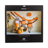 Back of retail package showing three oversized hanging pumpkin characters used as vintage Halloween decor across a wall, includes twine.