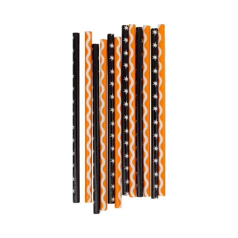 Set of vintage Halloween reusable straws in cream-stars-on-black and ric-rac-on-orange patterns, laid flat.
