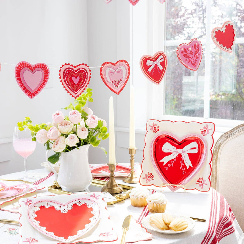 Vintage Heart Shaped Plate Set styled on a Valentine’s Day table with candles and florals