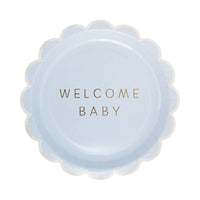 Blue scalloped paper plate with gold foil welcome baby text on white background