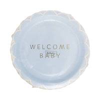 Packaging of blue welcome baby plate with scalloped edge and gold foil lettering