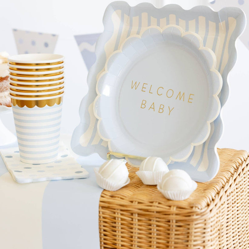 Welcome baby blue plate styled on baby shower table with pastel decor