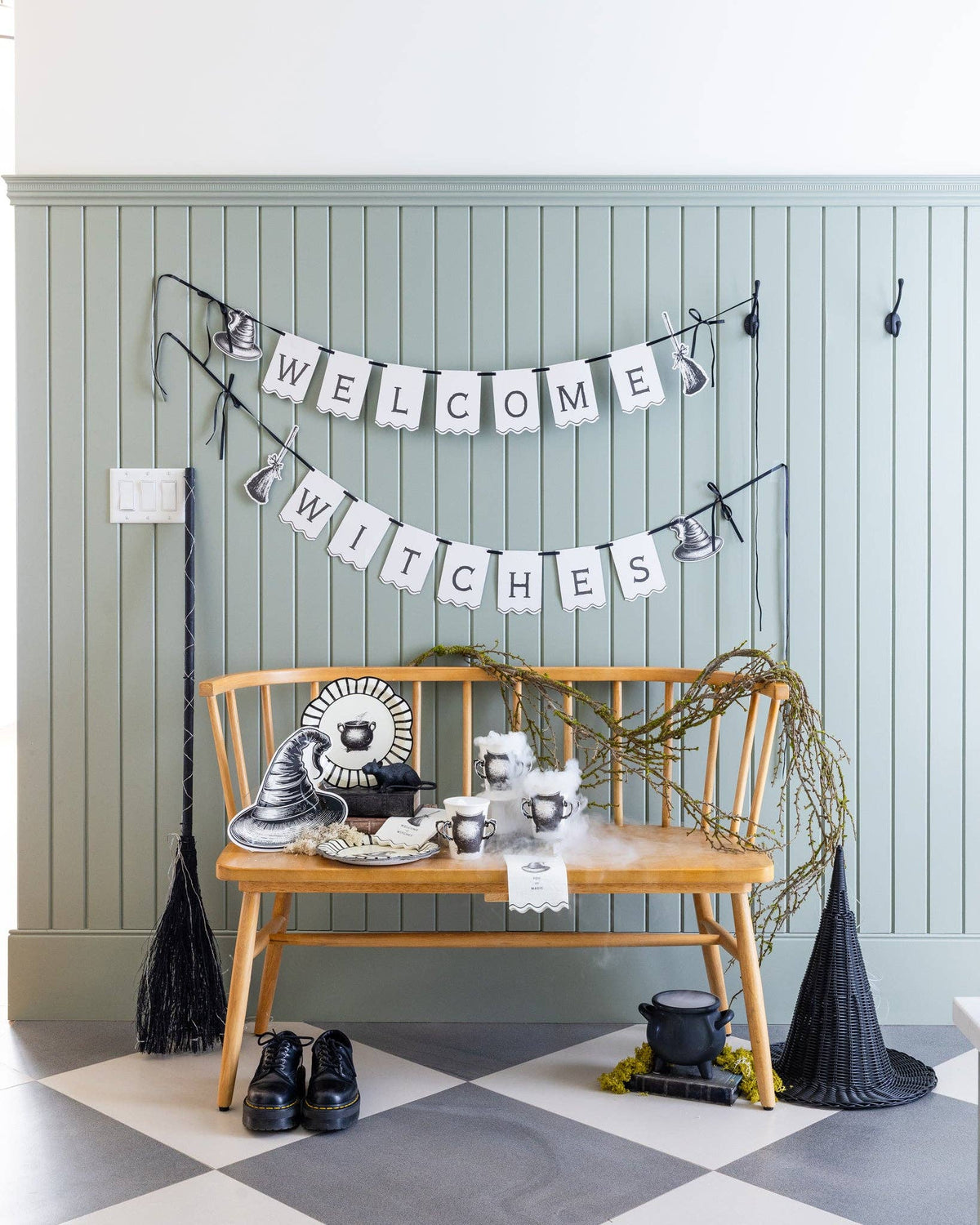 Halloween design with the Welcome Witches paper banner above a witch design bench. 