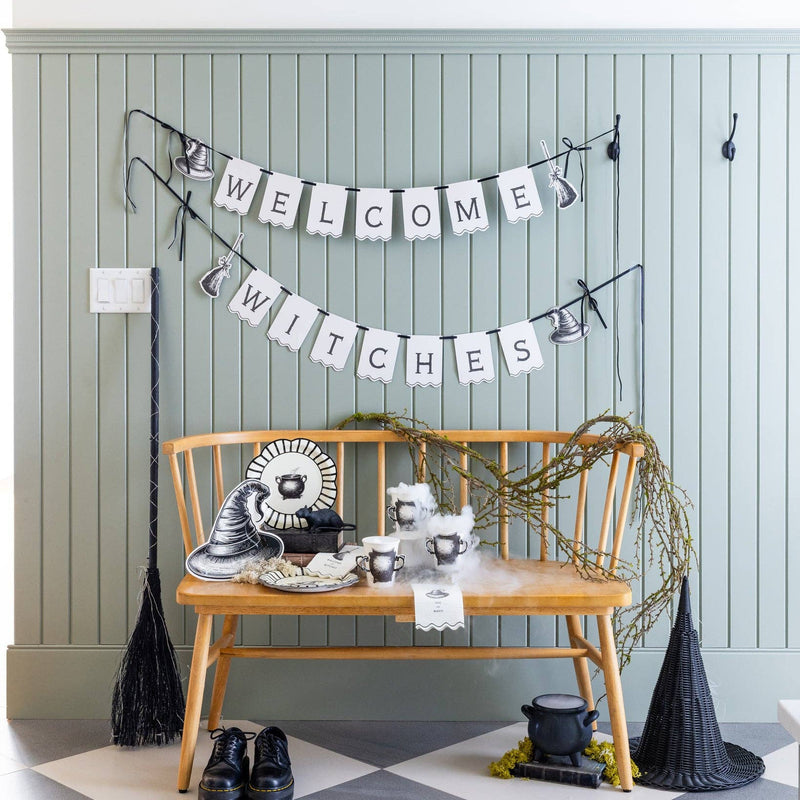 Halloween design with the Welcome Witches paper banner above a witch design bench. 